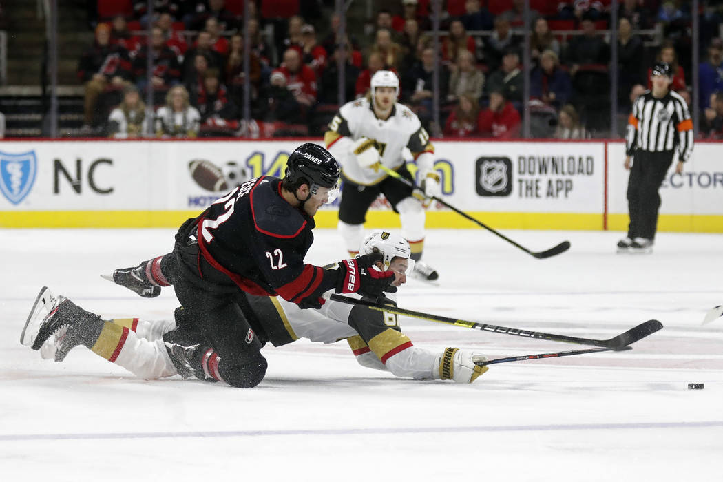 Carolina Hurricanes defenseman Brett Pesce (22) and Vegas Golden Knights right wing Mark Stone ...