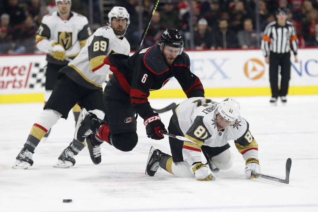 Carolina Hurricanes defenseman Joel Edmundson (6) and Vegas Golden Knights center Jonathan Marc ...