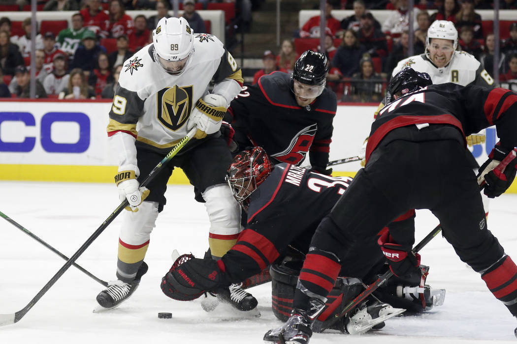 Vegas Golden Knights right wing Alex Tuch (89) tries to score against Carolina Hurricanes goalt ...