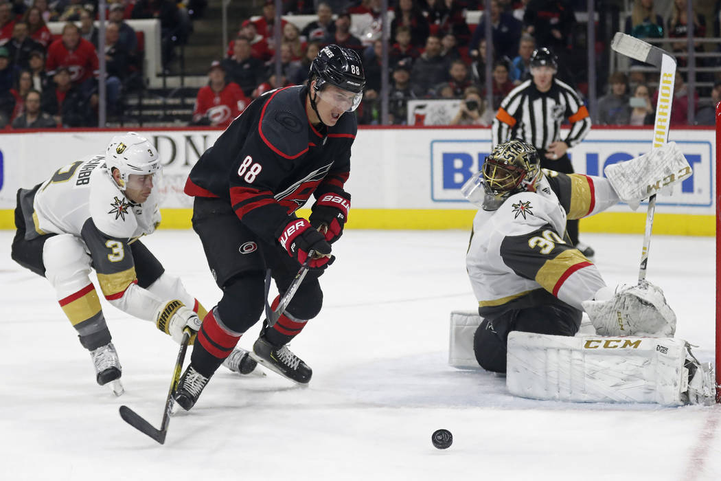 Vegas Golden Knights defenseman Brayden McNabb (3) and goaltender Malcolm Subban (30) defend th ...