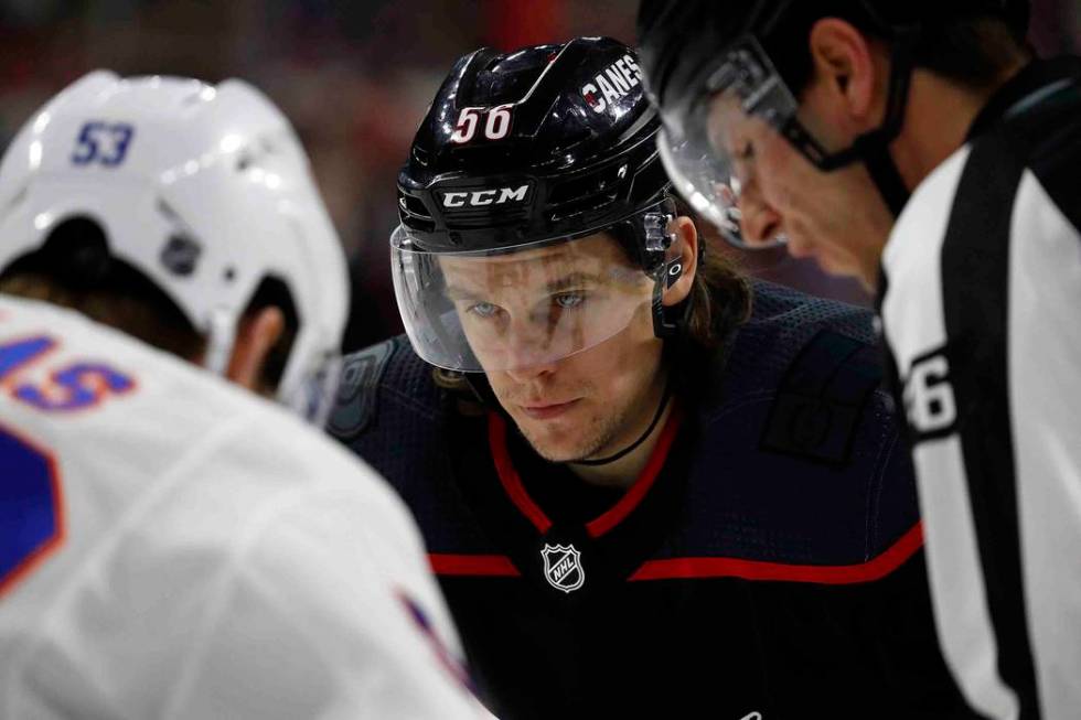 Carolina Hurricanes' Erik Haula (56) prepares for a face-off against New York Islanders' Casey ...