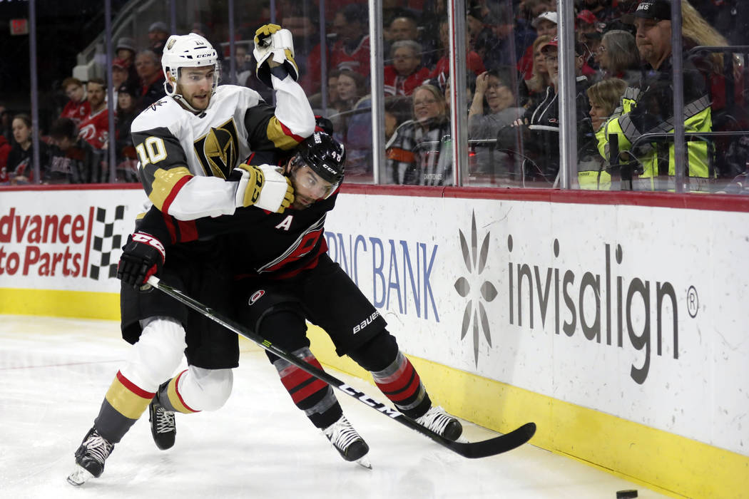 Vegas Golden Knights center Nicolas Roy (10) and Carolina Hurricanes left wing Jordan Martinook ...