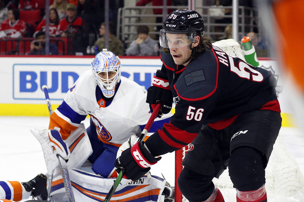 Carolina Hurricanes' Erik Haula (56) passes the puck as New York Islanders goaltender Thomas Gr ...