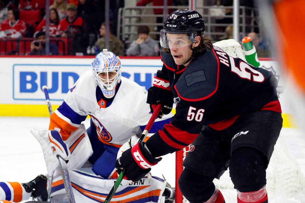 Carolina Hurricanes' Erik Haula (56) passes the puck as New York Islanders goaltender Thomas Gr ...