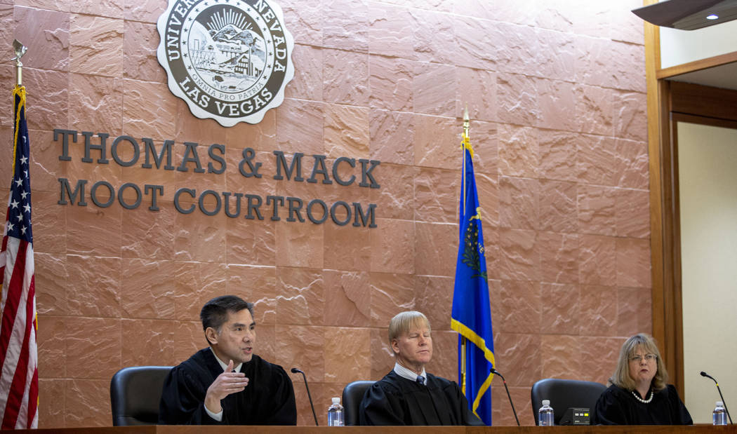 Judge Jerry Tao, left, Chief Judge Michael Gibbons, center, and Judge Bonnie Bulla, speak wit ...