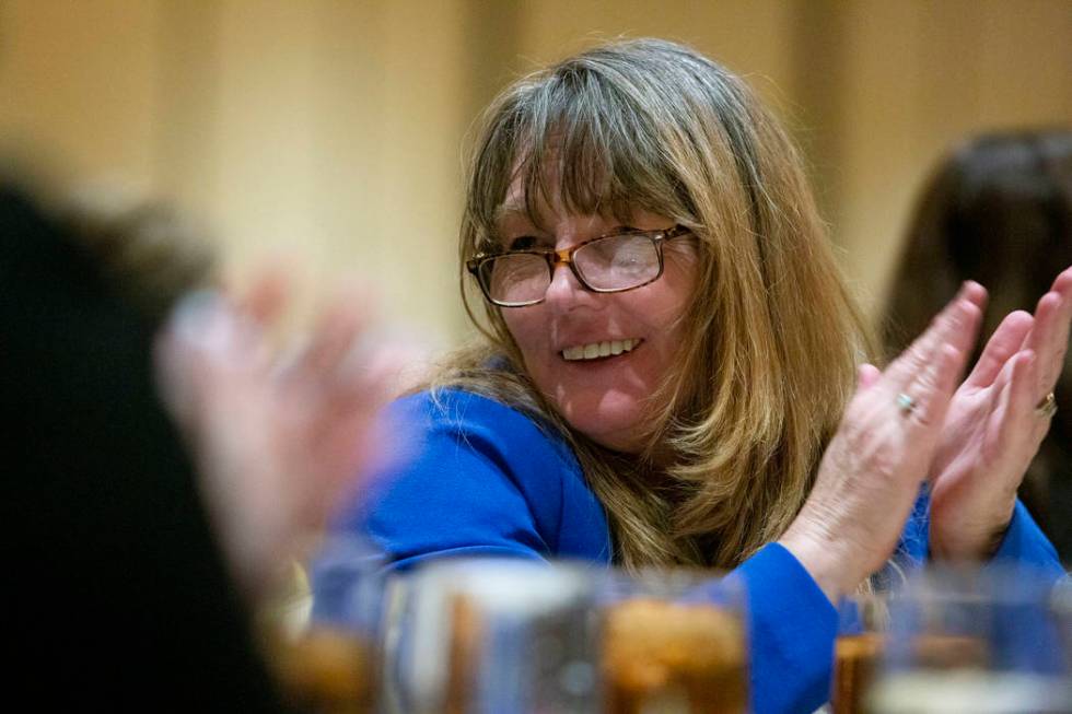 Clark County Commissioners Marilyn Kirkpatrick claps as North Las Vegas Mayor John Lee speaks d ...