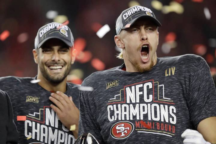 San Francisco 49ers quarterback Jimmy Garoppolo, left, and tight end George Kittle celebrate af ...