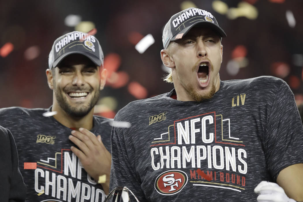 San Francisco 49ers quarterback Jimmy Garoppolo, left, and tight end George Kittle celebrate af ...