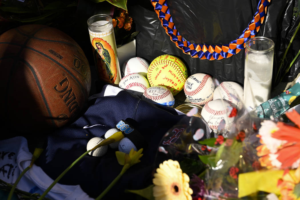 Baseballs sit in a memorial made for John Altobelli, the late head coach of Orange Coast Colleg ...