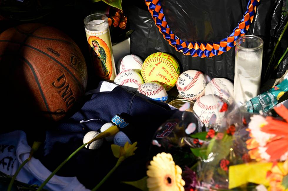 Baseballs sit in a memorial made for John Altobelli, the late head coach of Orange Coast Colleg ...