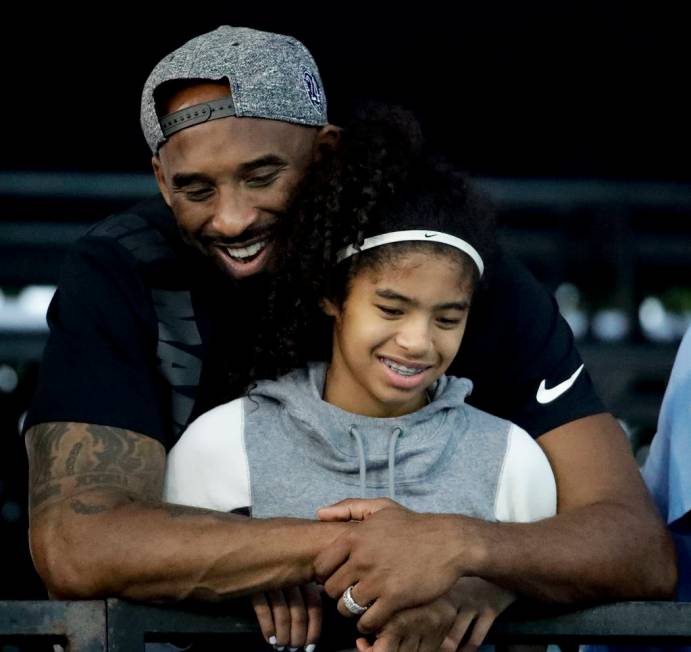 In a July 26, 2018 file photo former Los Angeles Laker Kobe Bryant and his daughter Gianna watc ...