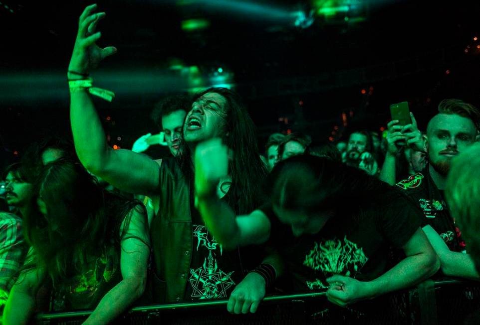 Fans react as Triumph of Death performs at the Mandalay Bay Events Center during the Psycho Las ...