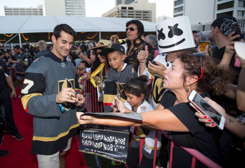 Vegas Golden Knights left wing Max Pacioretty (67), left, signs autographs during a Vegas Golde ...