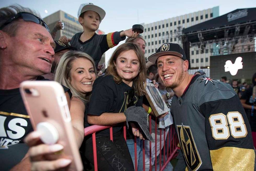 Vegas Golden Knights defenseman Nate Schmidt (88) poses with fans during a Vegas Golden Knights ...