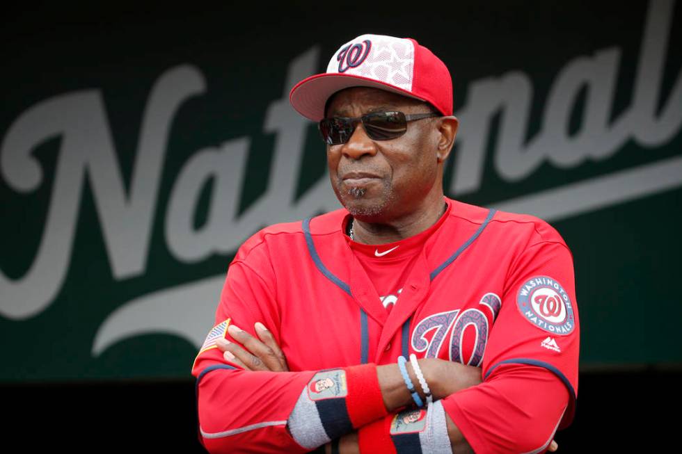 FILE- In this July 4, 2016, file photo, Washington Nationals manager Dusty Baker (12) stands i ...