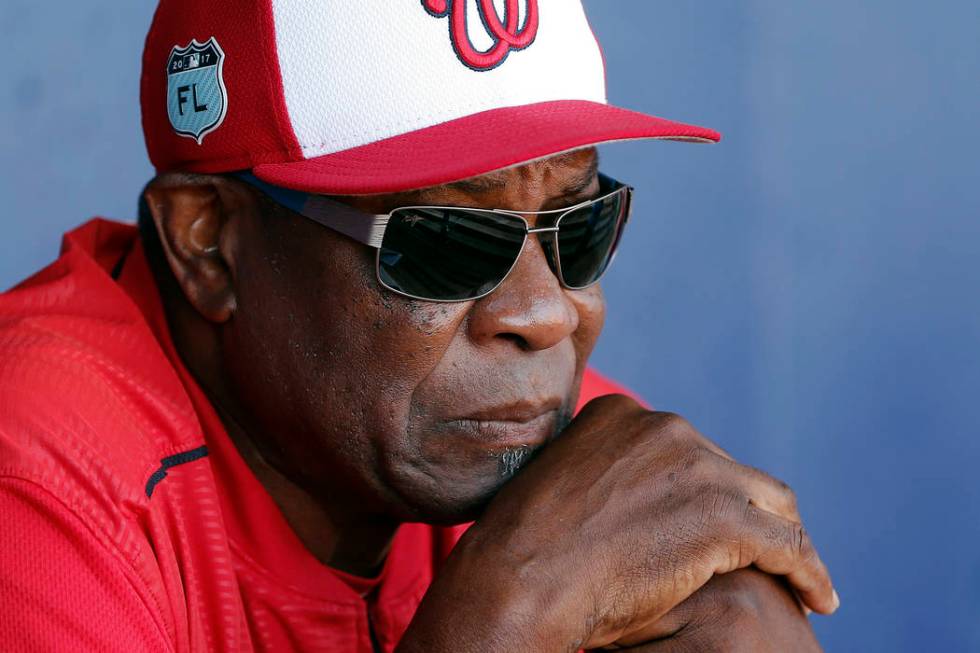 FILE - In this March 11, 2017, file photo, Washington Nationals manager Dusty Baker talks to re ...