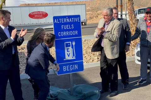 Gov. Steve Sisolak (third from right) and other dignitaries unveil Interstate 15 as an Electric ...