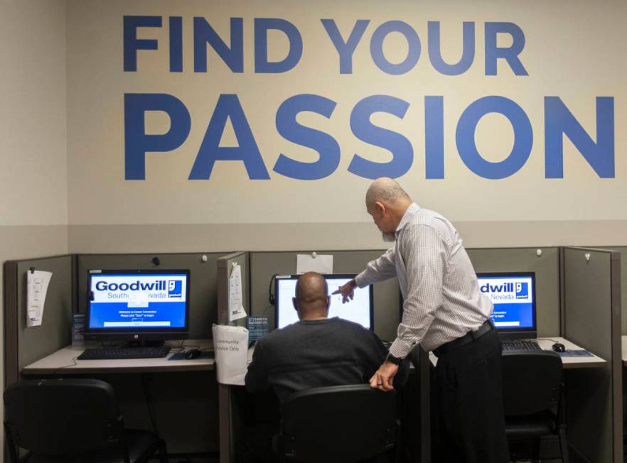 Marco Martinez, right, assists Donald Chapman at the Goodwill of Southern Nevada's career cente ...