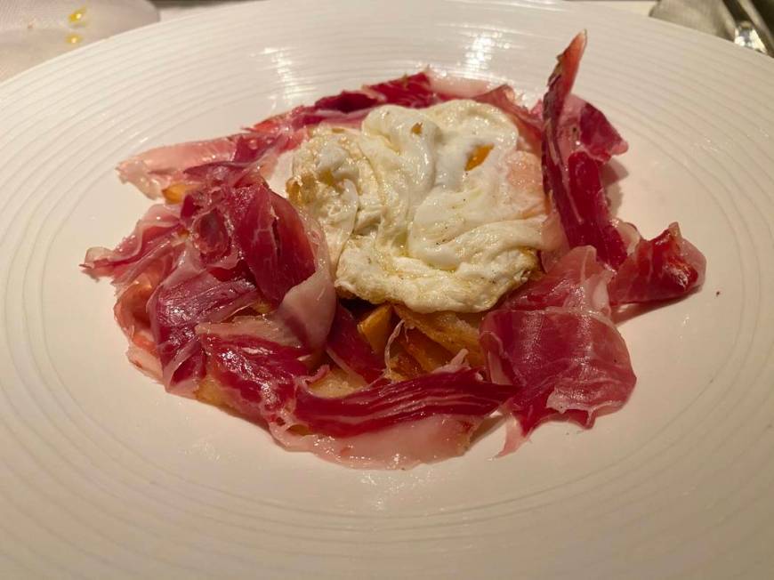 Huevos Estrellados with jamon Iberico (Traditional mix of fried potatoes and organic free-range ...