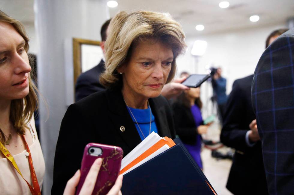 Sen. Lisa Murkowski, R-Alaska, speaks with reporters during the impeachment trial of President ...