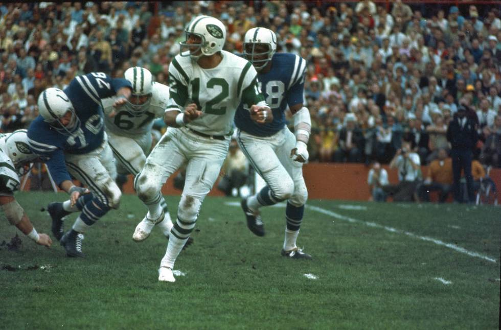 New York Jets quarterback (12) Joe Namath gets off a pass under pressure from the Baltimore Col ...