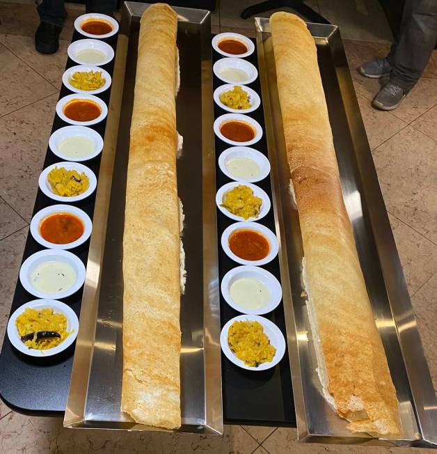 Divine Dosa's 4-foot dosas with chutneys and sambhar. (Divine Dosa & Biryani)