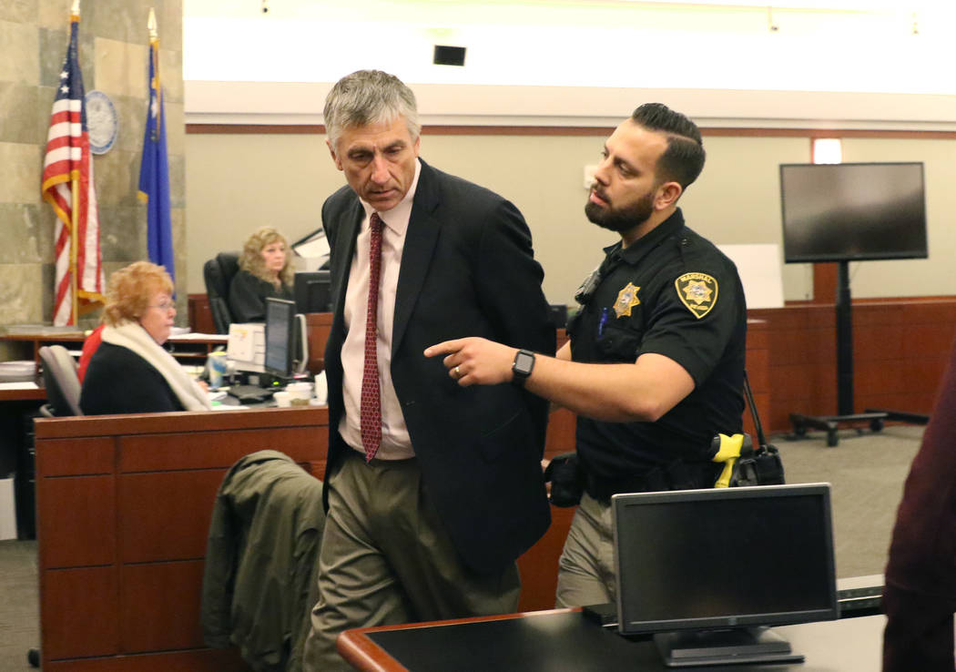 Former attorney William Gamage is led out of the courtroom after his sentencing at the Regional ...