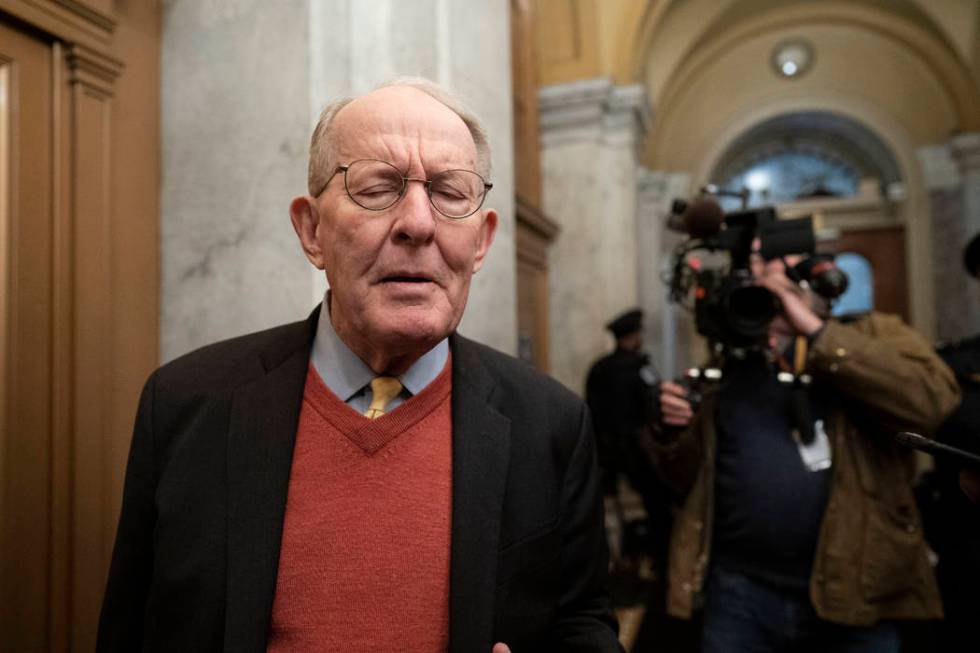 Republican Sen. Lamar Alexander of Tennessee, talks to reporters as he arrives at the Capitol f ...