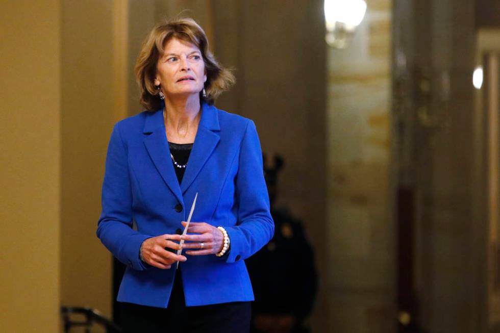 Sen. Lisa Murkowski, R-Alaska, returns to the Senate chamber after a meeting in the Majority Le ...