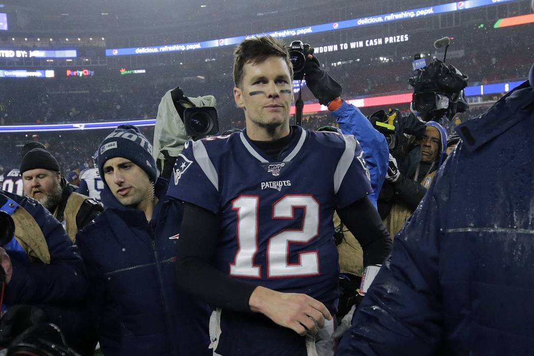 New England Patriots quarterback Tom Brady leaves the field after losing an NFL wild-card playo ...