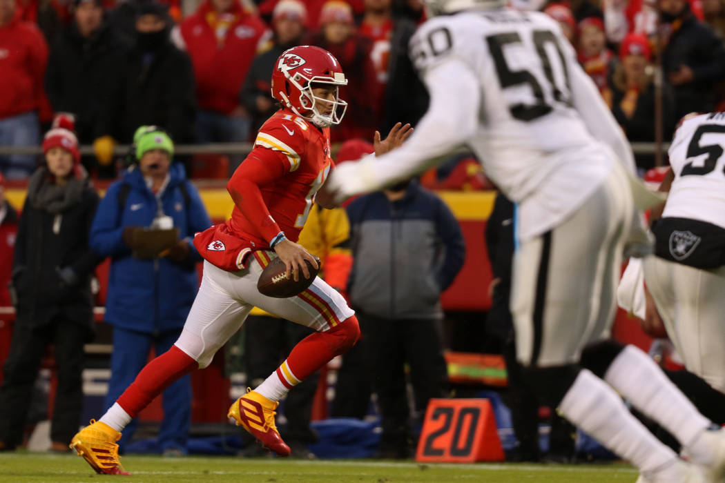 Kansas City Chiefs quarterback Patrick Mahomes (15) runs for the end zone during the first half ...