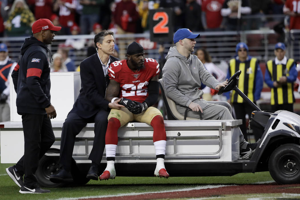 San Francisco 49ers running back Tevin Coleman is taken off the field during the first half of ...