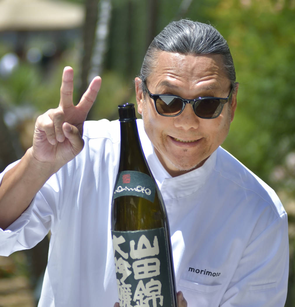 Chef Masaharu Morimoto is shown with a bottle of his sake during Picnic in the Park at the Park ...