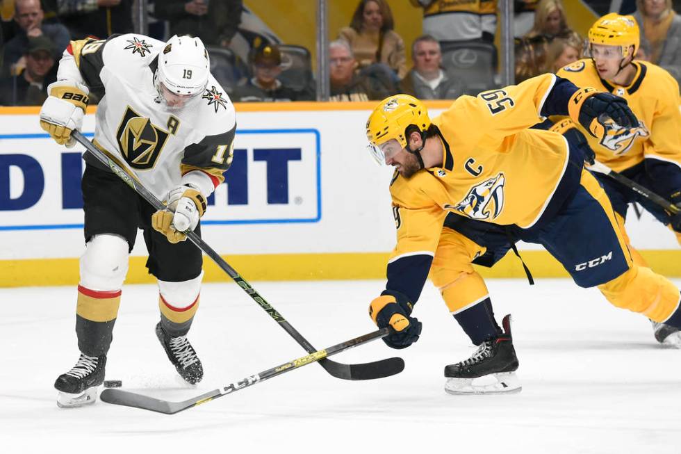 Nashville Predators defenseman Roman Josi (59), of Switzerland, pokes the puck away from Vegas ...