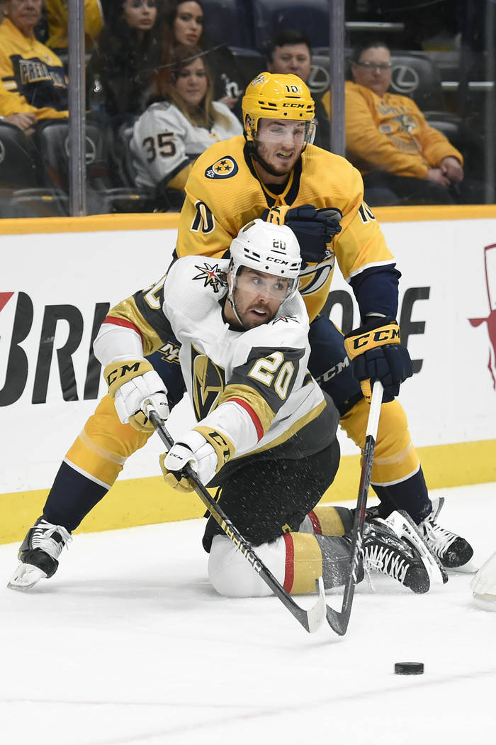 Vegas Golden Knights center Chandler Stephenson (20) passes the puck in front of Nashville Pred ...