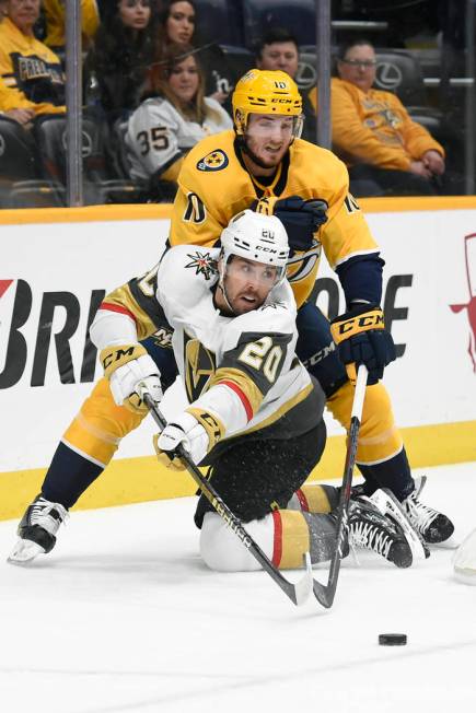 Vegas Golden Knights center Chandler Stephenson (20) passes the puck in front of Nashville Pred ...