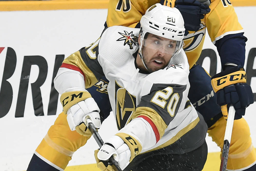 Vegas Golden Knights center Chandler Stephenson (20) passes the puck in front of Nashville Pred ...