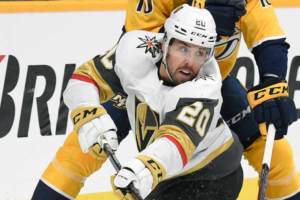 Vegas Golden Knights center Chandler Stephenson (20) passes the puck in front of Nashville Pred ...