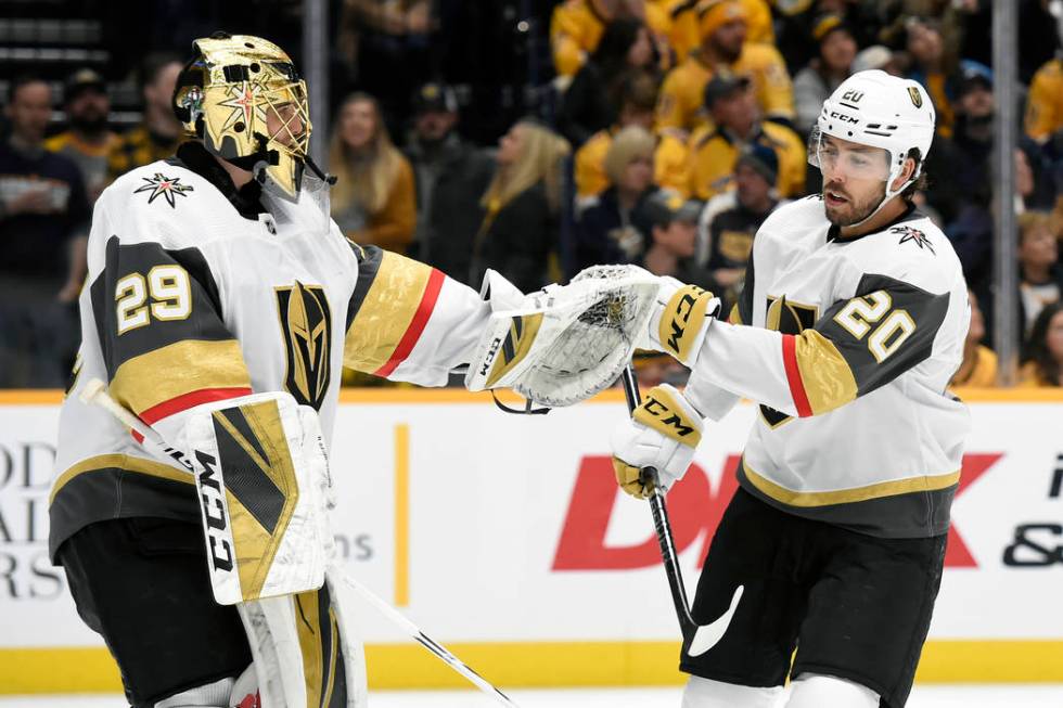 Vegas Golden Knights center Chandler Stephenson (20) is congratulated by goaltender Marc-Andre ...