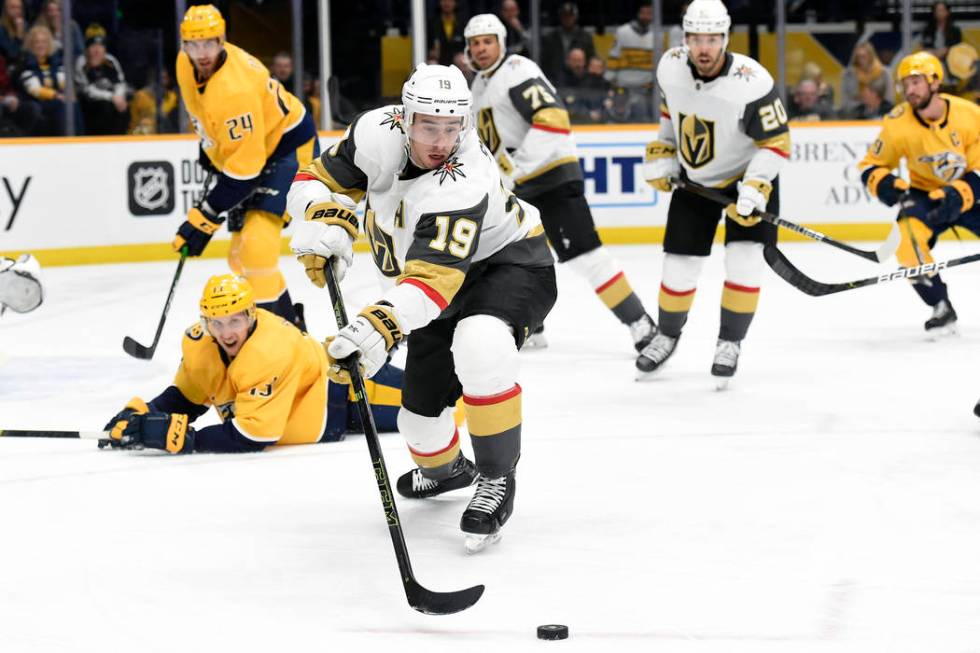 Vegas Golden Knights right wing Reilly Smith (19) moves the puck away from Nashville Predators ...