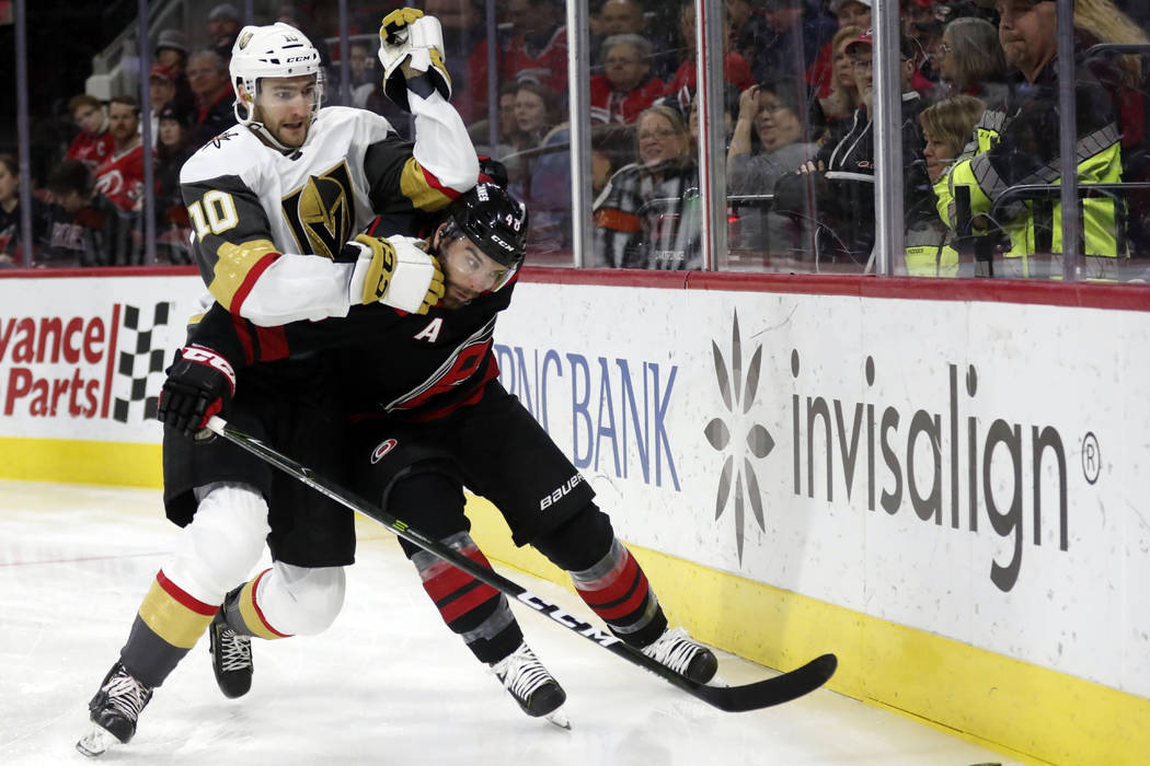 Vegas Golden Knights center Nicolas Roy (10) and Carolina Hurricanes left wing Jordan Martinook ...