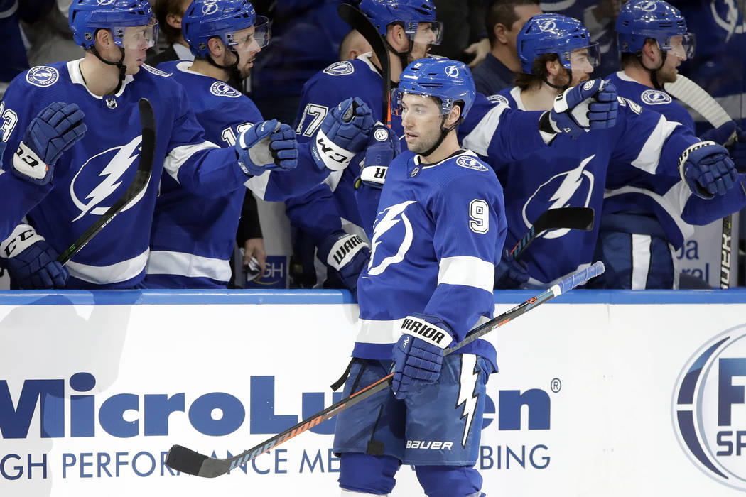 Vegas Golden Knights right wing Mark Stone (61) skates around Tampa Bay Lightning right wing Ni ...