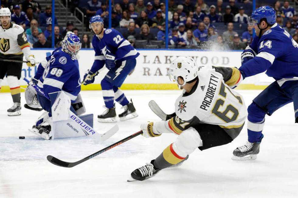 Vegas Golden Knights left wing Max Pacioretty (67) shoots behind Tampa Bay Lightning goaltender ...