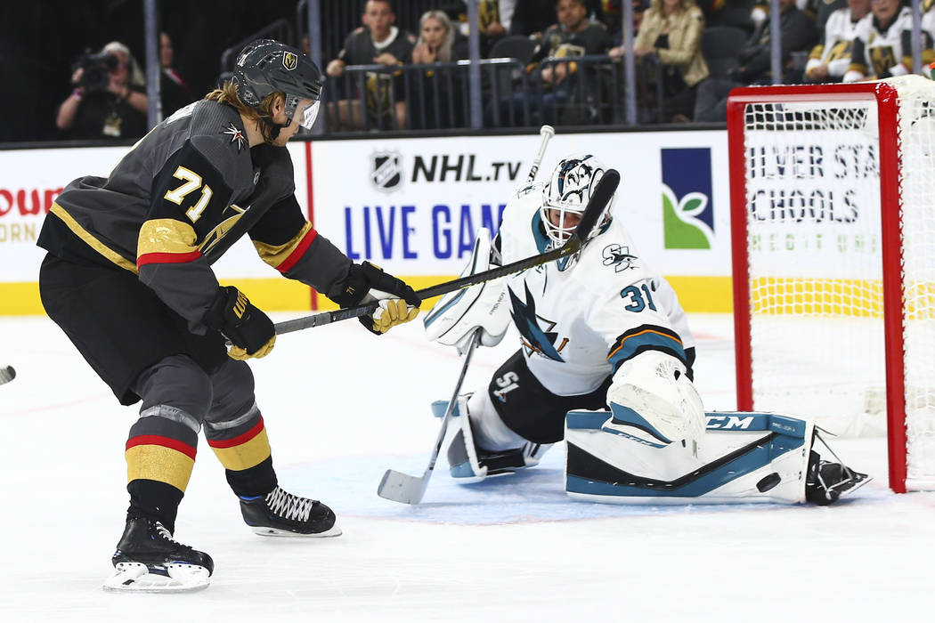 San Jose Sharks goaltender Martin Jones (31) blocks a shot from Golden Knights' William Karlsso ...