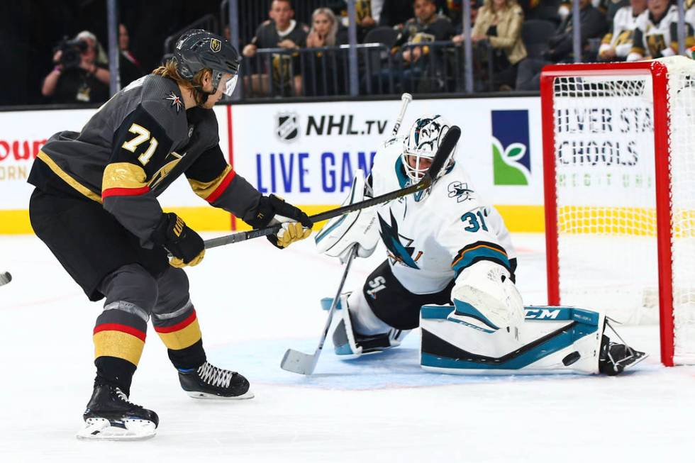 San Jose Sharks goaltender Martin Jones (31) blocks a shot from Golden Knights' William Karlsso ...