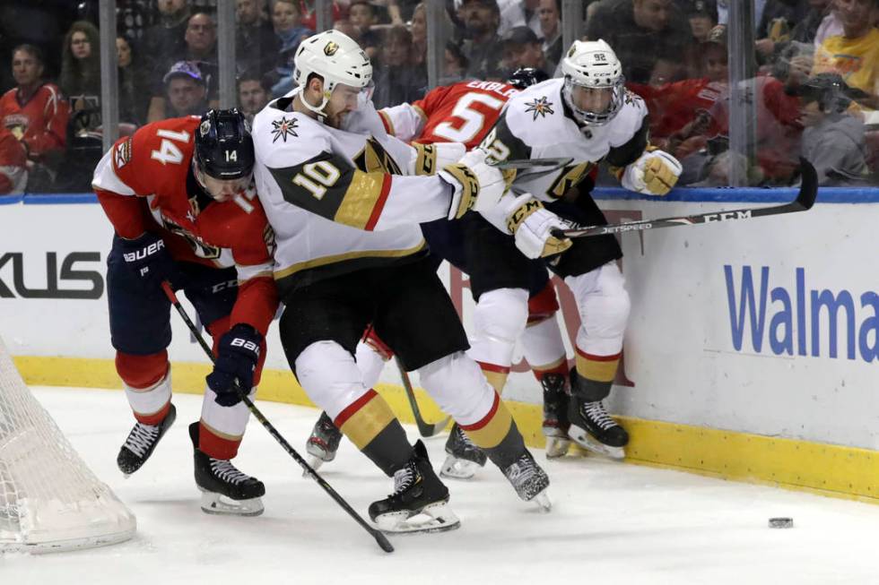 Florida Panthers center Dominic Toninato (14) and Vegas Golden Knights center Nicolas Roy (10) ...