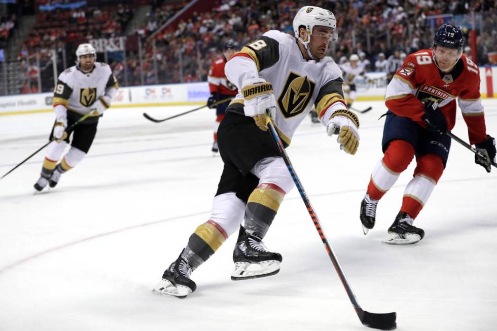 Vegas Golden Knights left wing William Carrier, left skates with the puck as Florida Panthers d ...