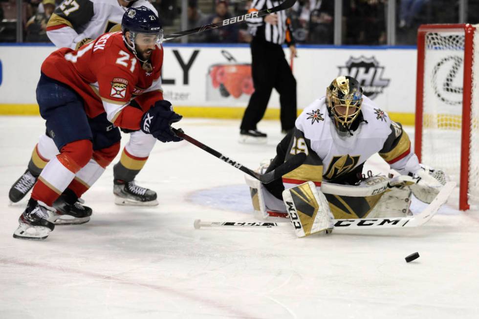 Vegas Golden Knights goaltender Marc-Andre Fleury, right, defends the goal as Florida Panthers ...