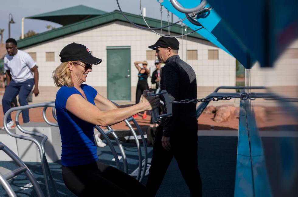 Las Vegas Parks and Recreation manager Jana Bruner tests out the new outdoor Fitness Court by t ...