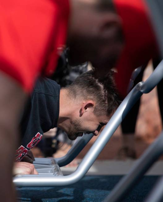 Former UNLV athlete Chase Skenandore does pushups to demonstrate the new outdoor Fitness Court ...